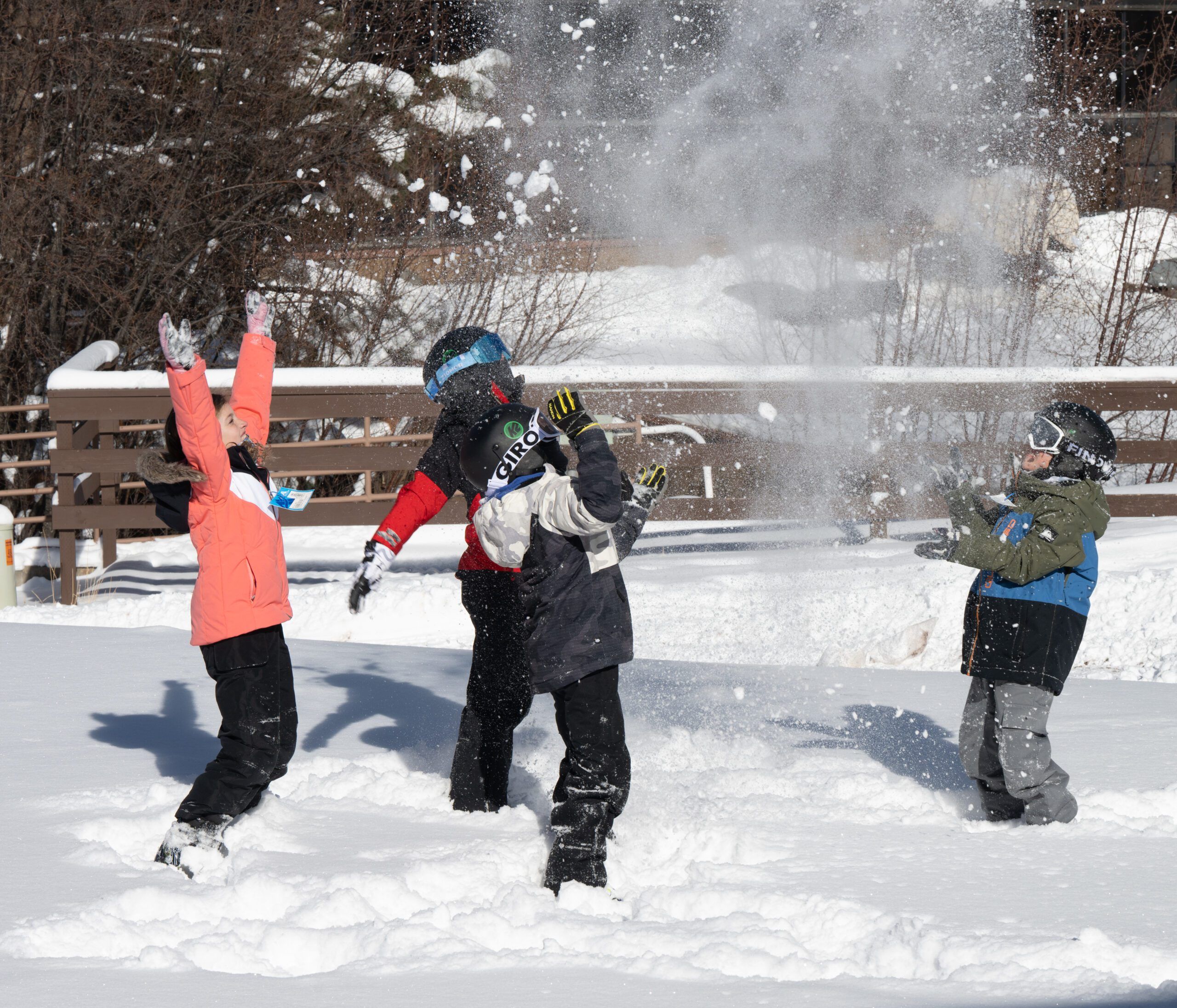Group of kids throwing snowballs in Angel Fire, New Mexico.